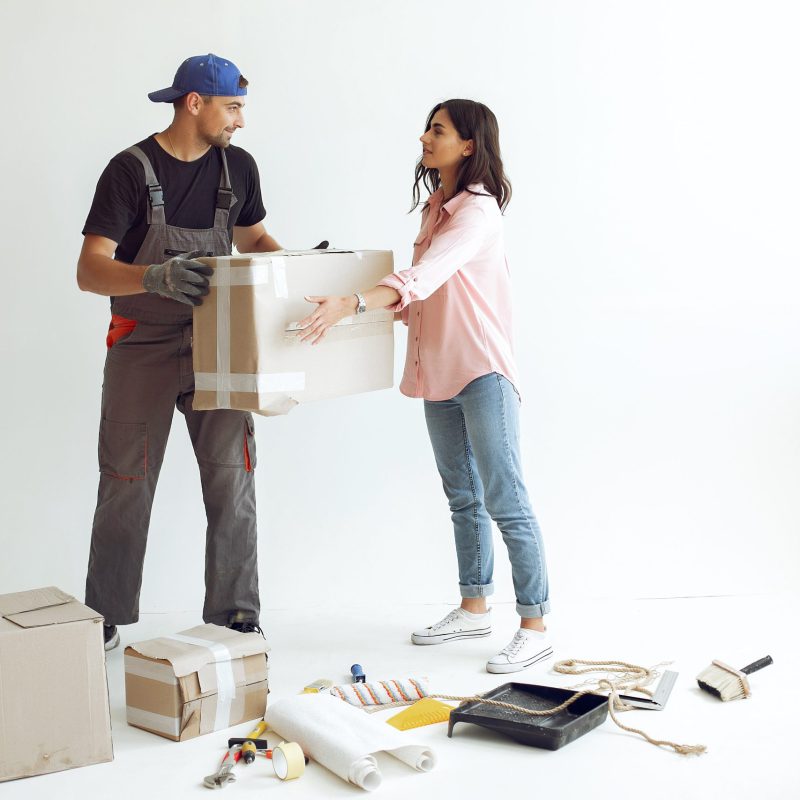 Family repairs. Couple at home. Woman in a pink blouse